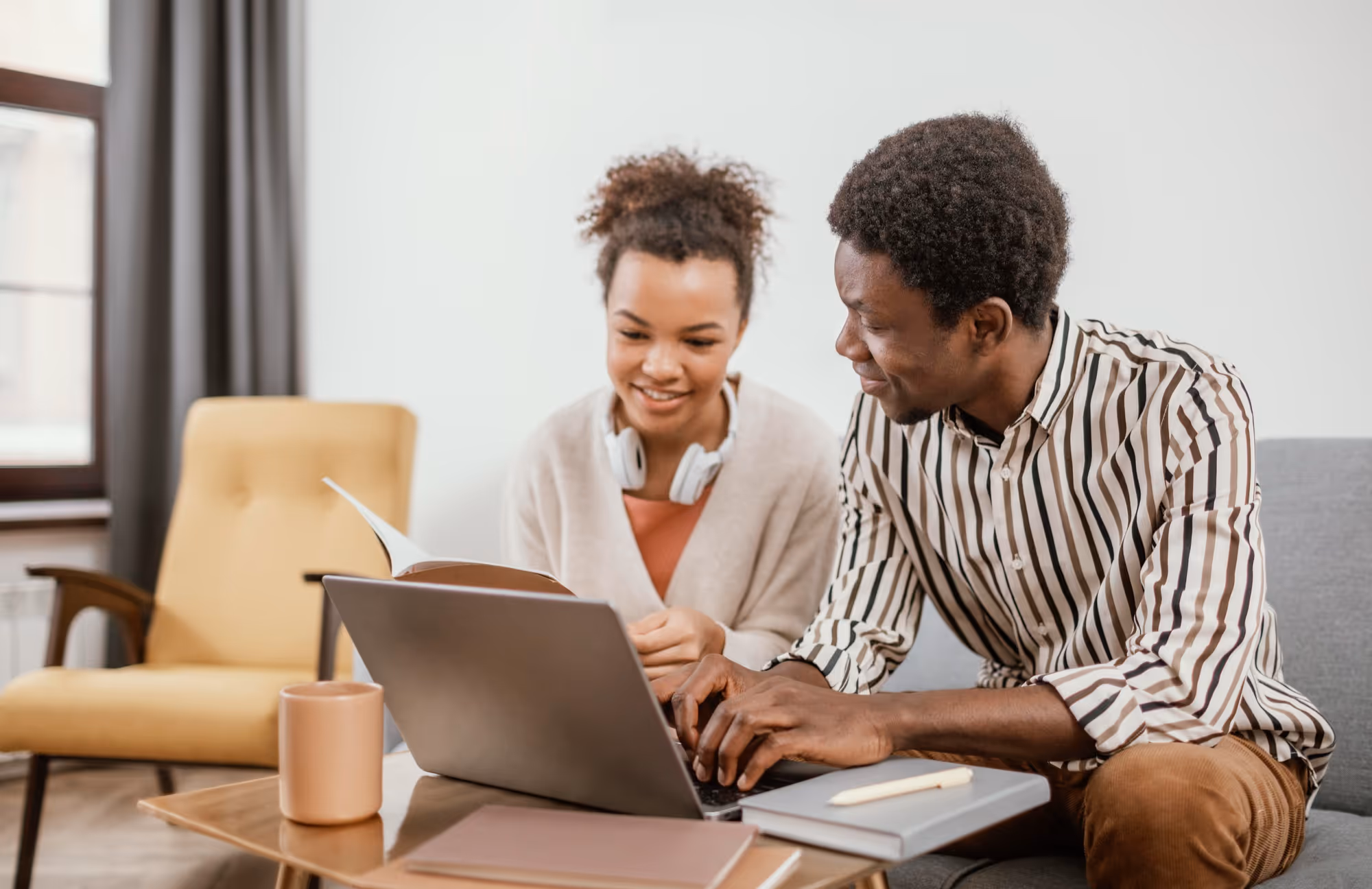 Young pair looking at laptop