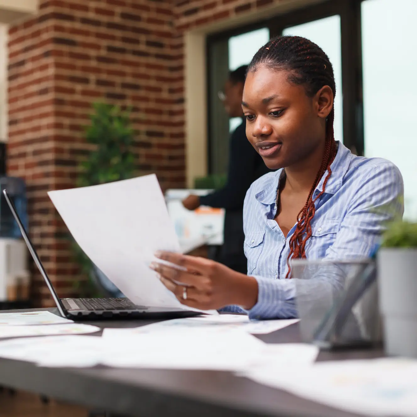 young woman looking over documents
