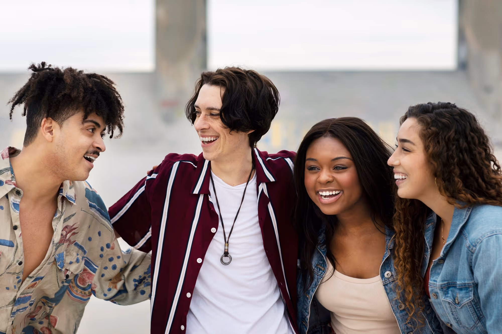 Group of smiling international students standing together