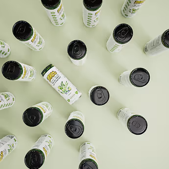 Pastel-toned overhead image of Limojito Perico Energy Drink cans arranged in a radial layout, showcasing the drink's freshness and natural ingredients.