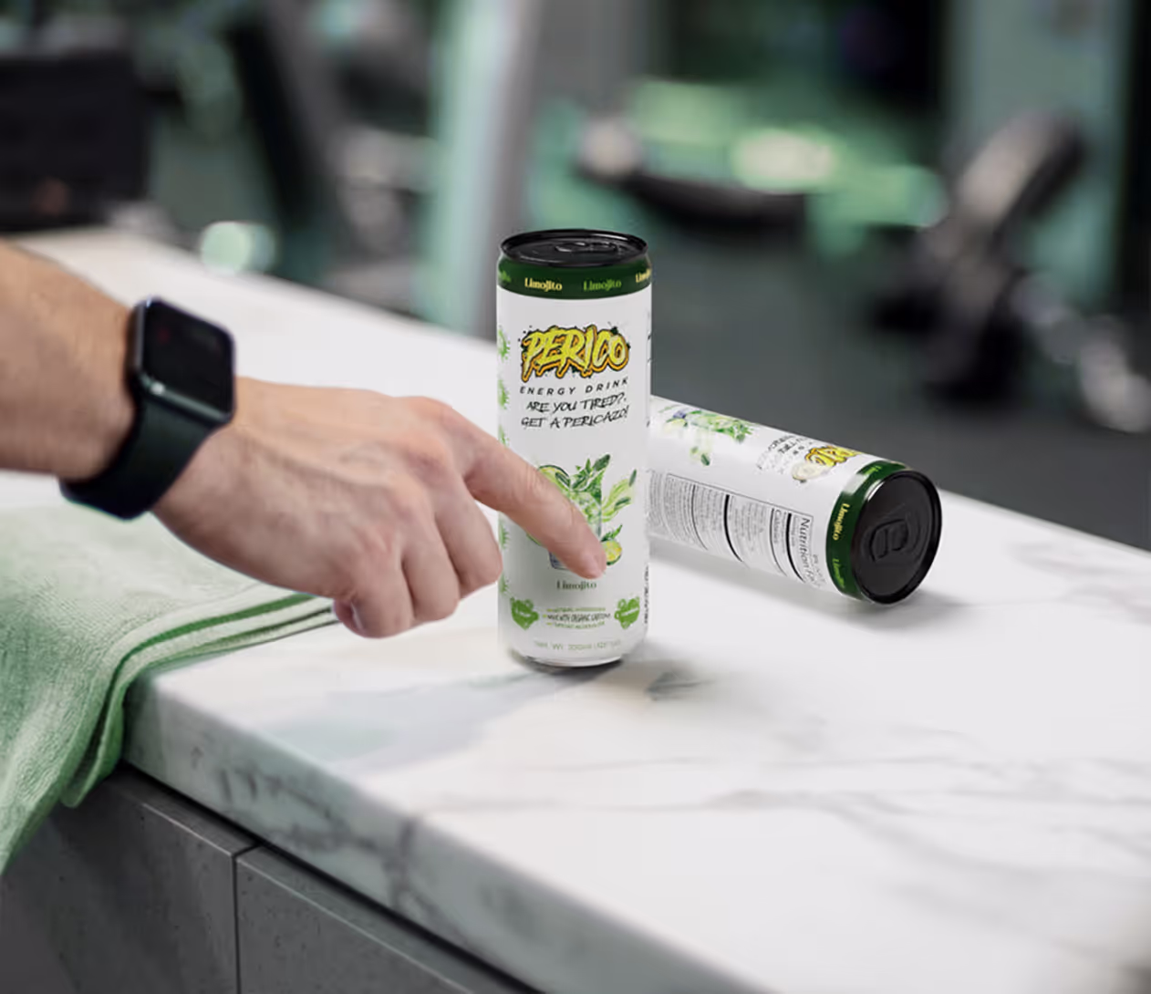 Perico Limojito Energy Drink placed on a marble counter in a gym setting, ideal for pre- or post-workout recovery and hydration support.
