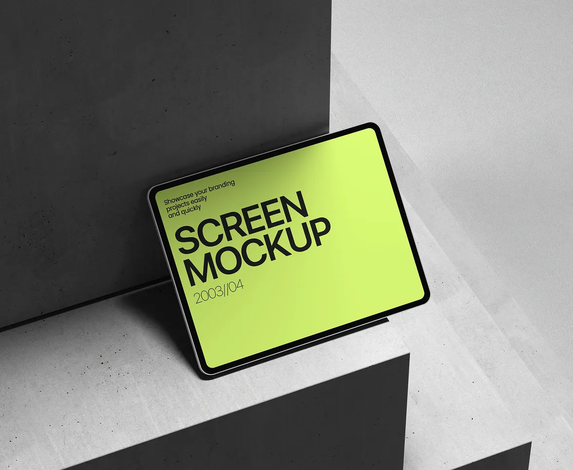 Tablet screen mockup resting on geometric concrete surfaces with a neon green display.