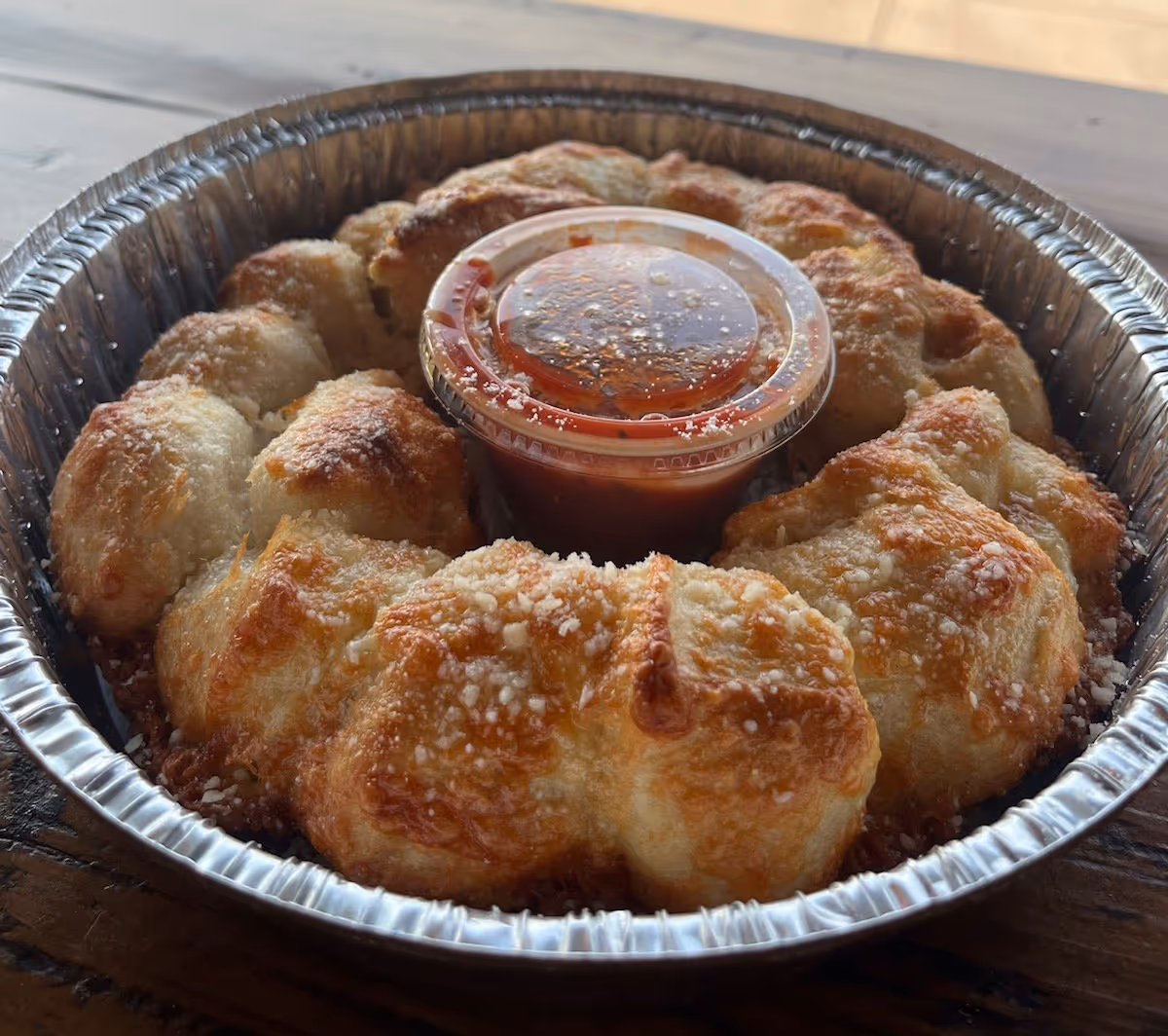 cheese bread with marinara sauce on the side