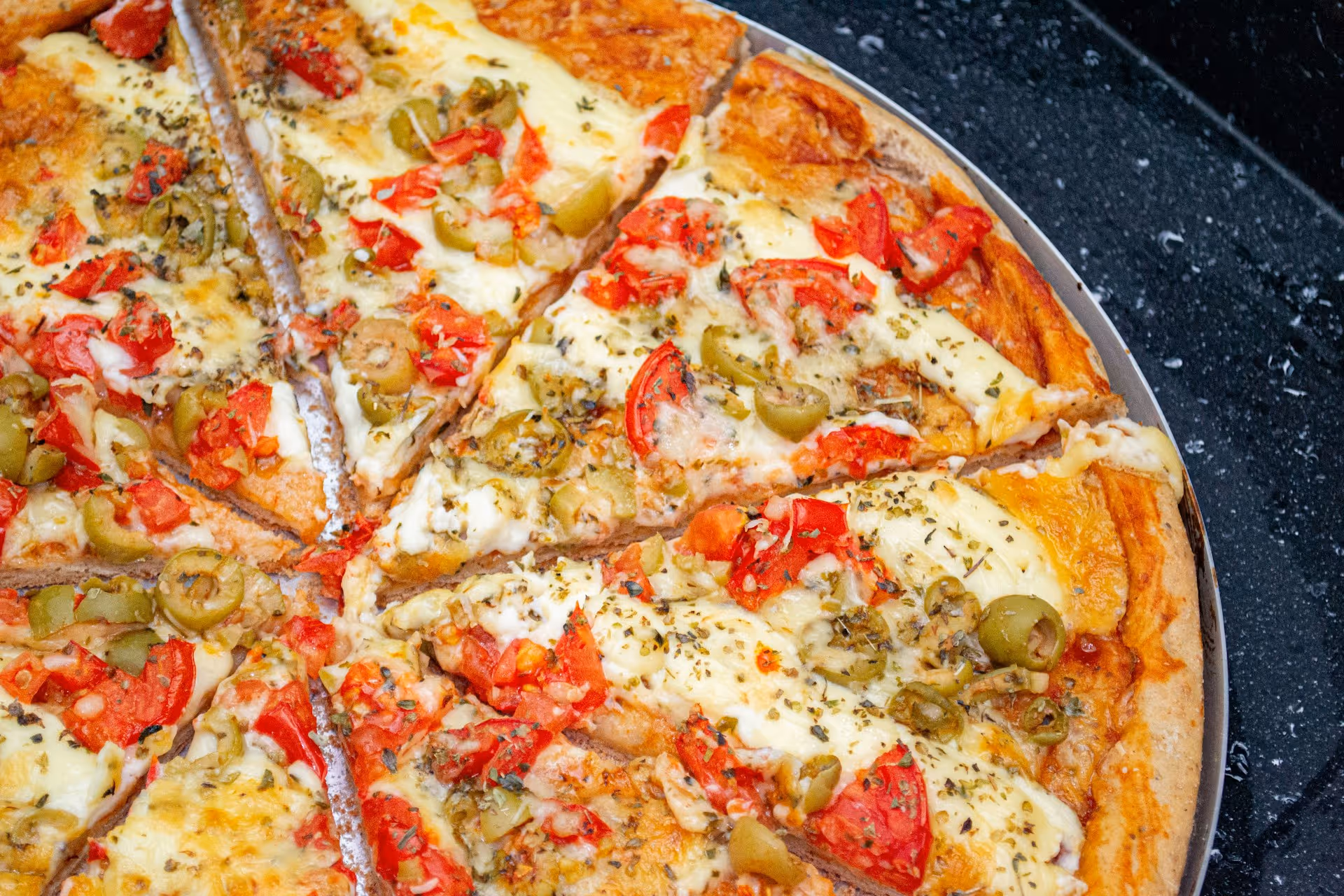 pizza with olives, cheese and tomatoes