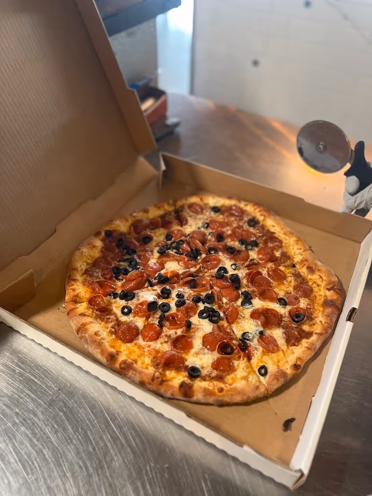 pizza with pepperoni and black olives