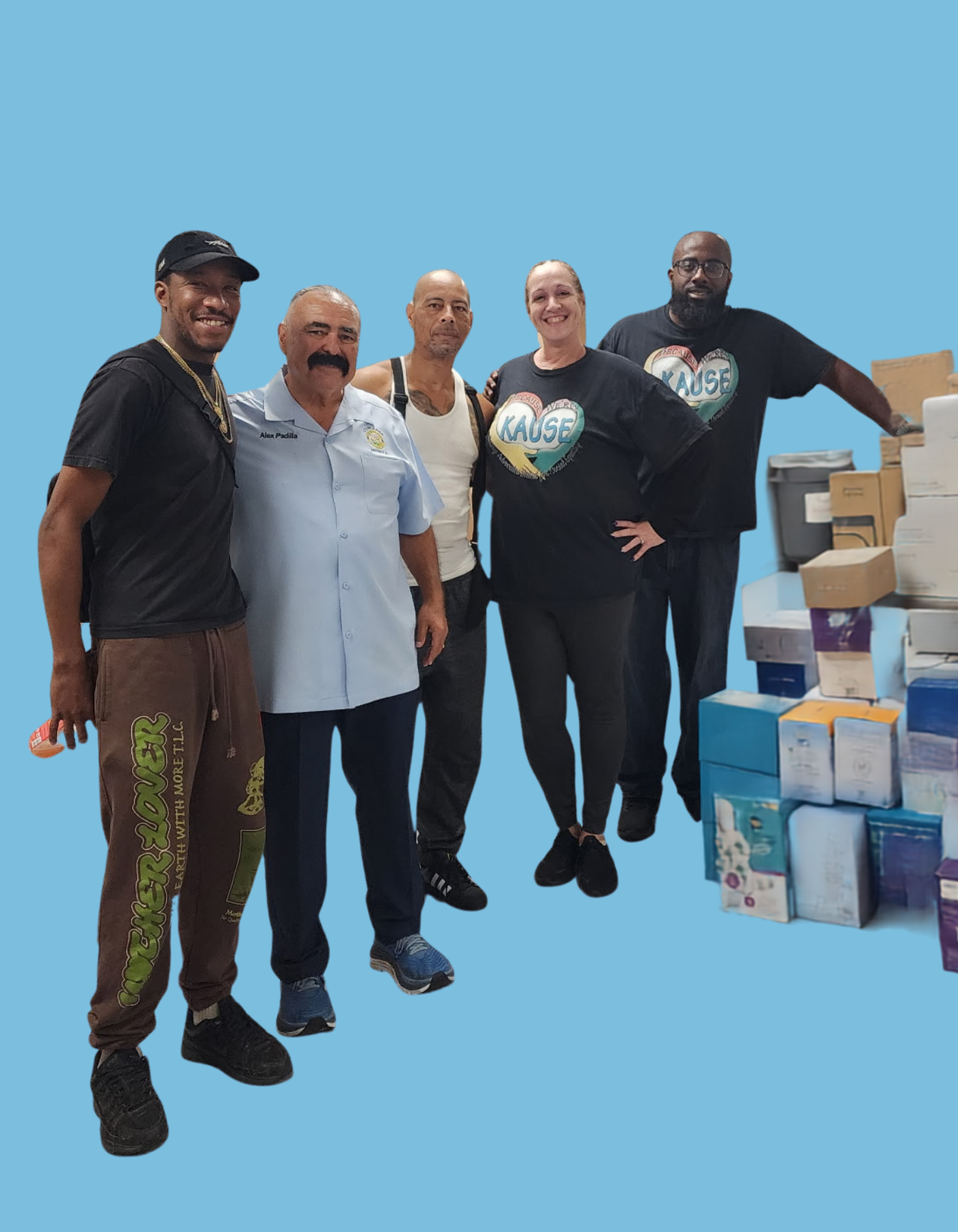 Volunteers stand by donated supplies for KAUSE