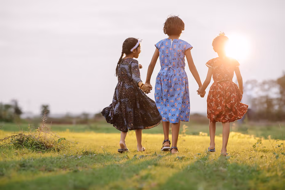 Girls walking in a field