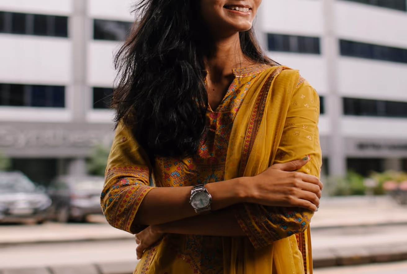 smiling woman in yellow