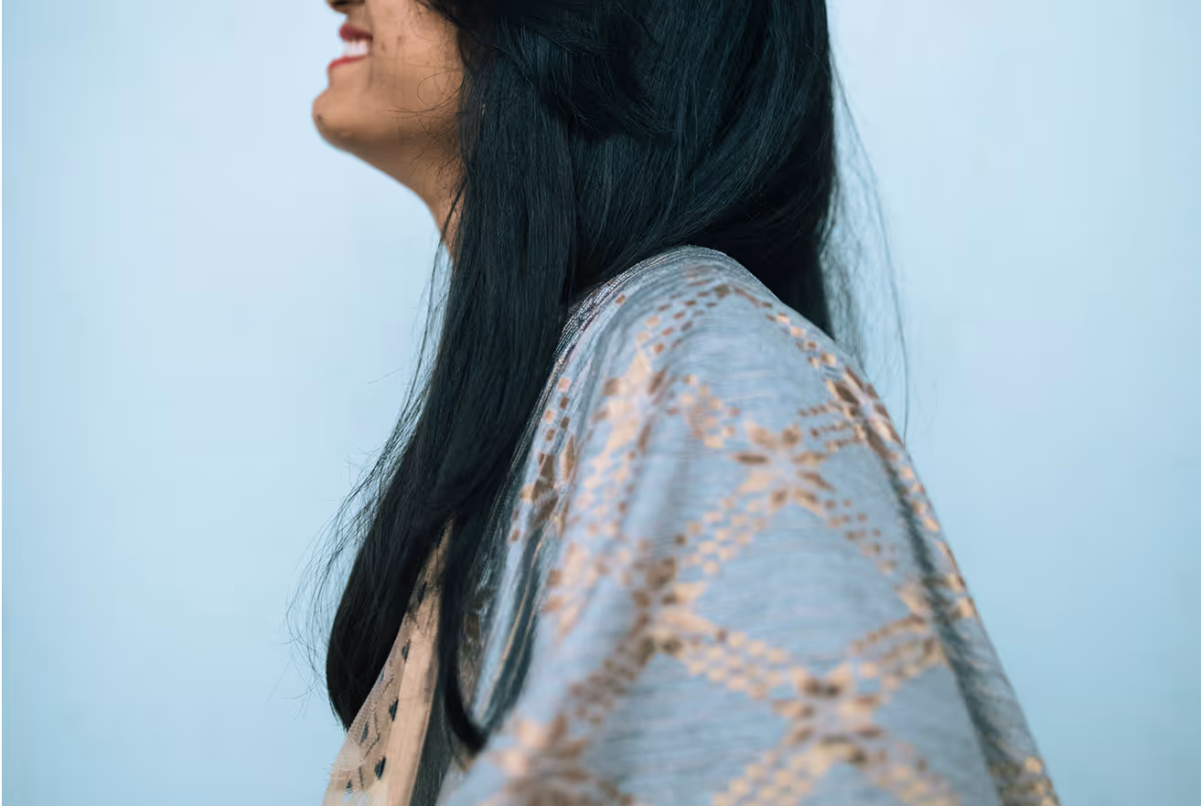 woman smiling in blue