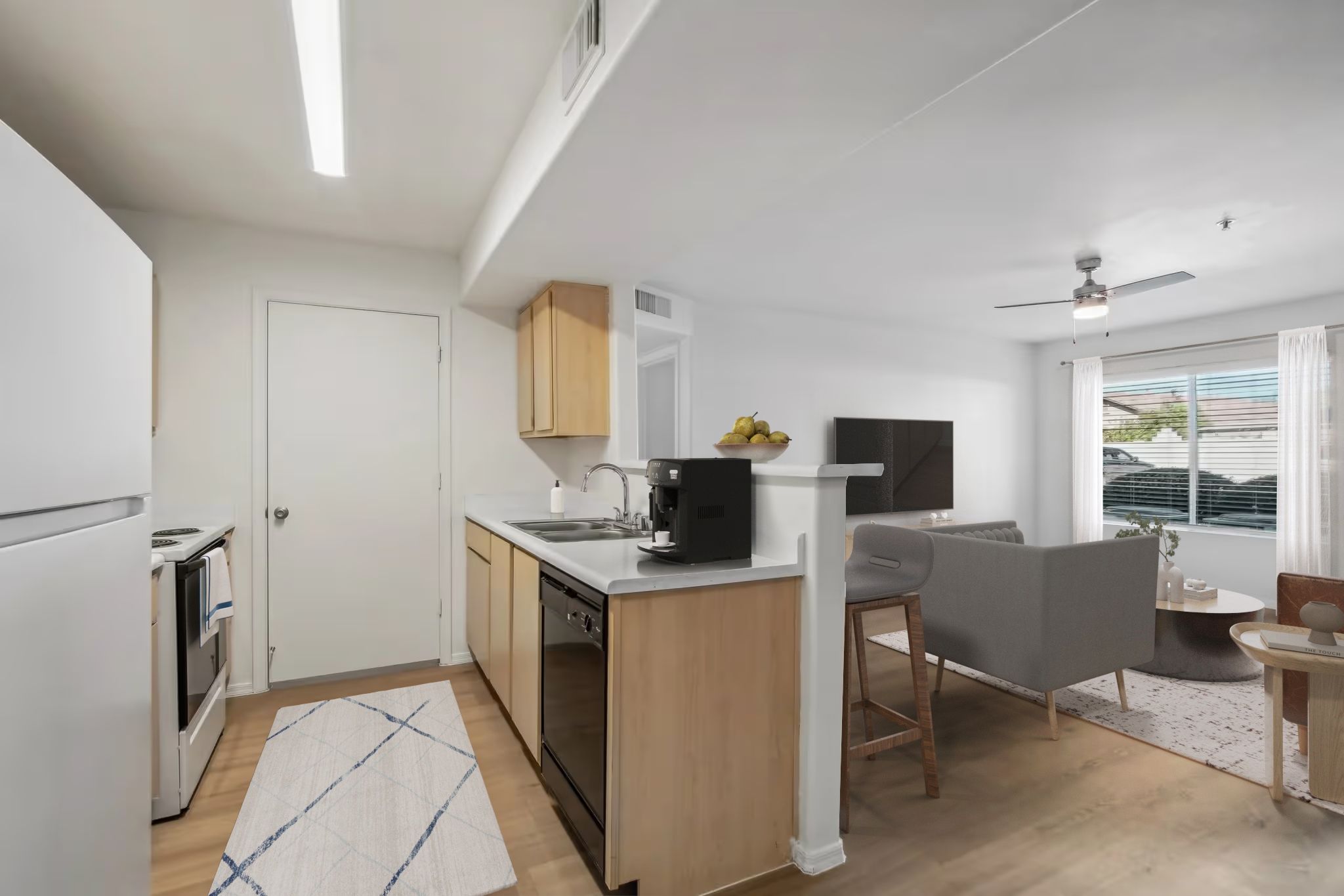 view kitchen and living area with sofa and tv