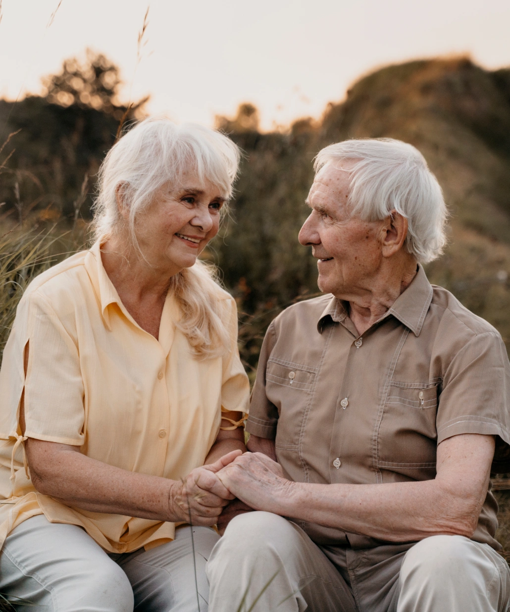 A man and a woman sitting next to each other.