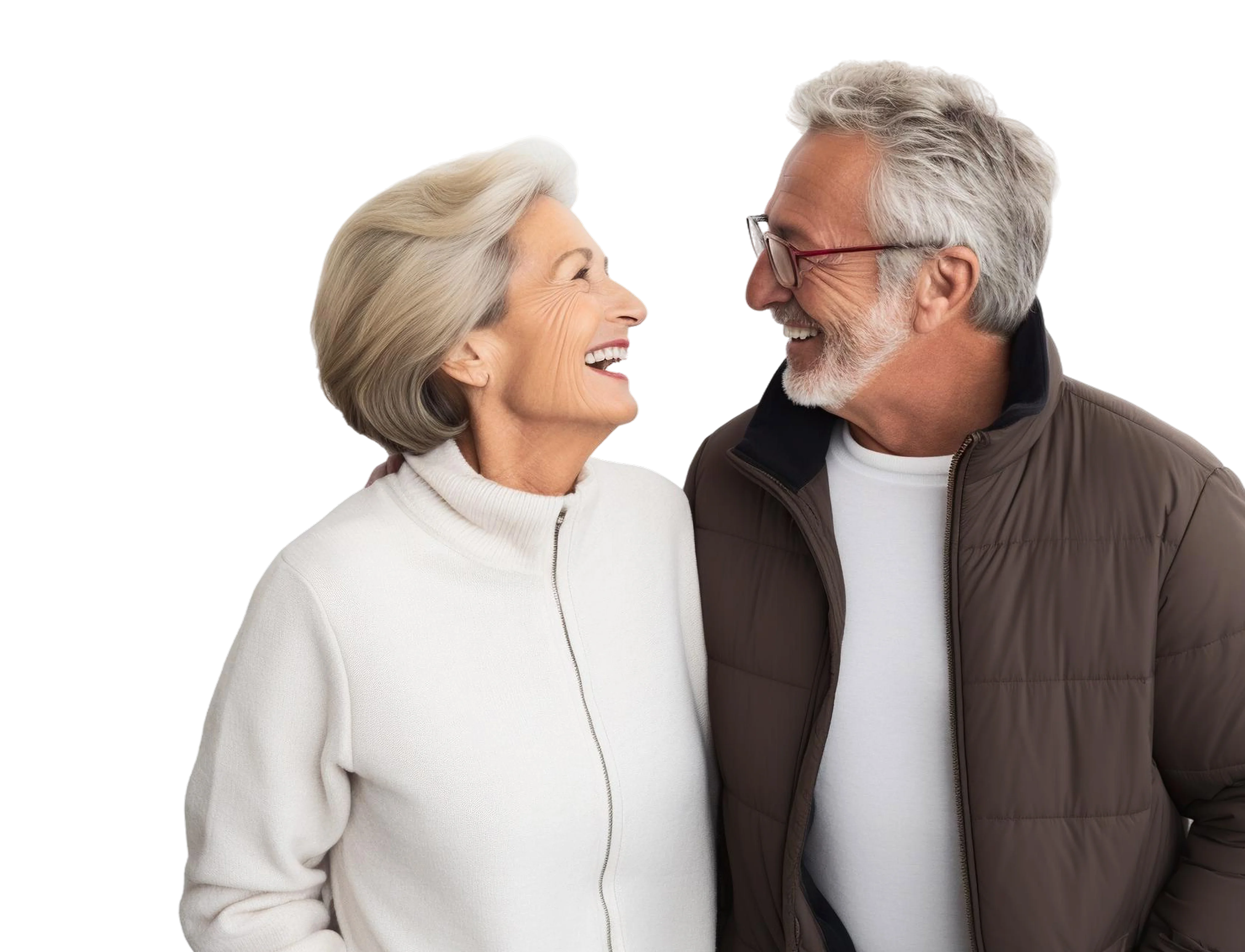 Smiling elderly couple looking at each other, woman wearing white zip-up sweater and man wearing brown jacket with glasses.