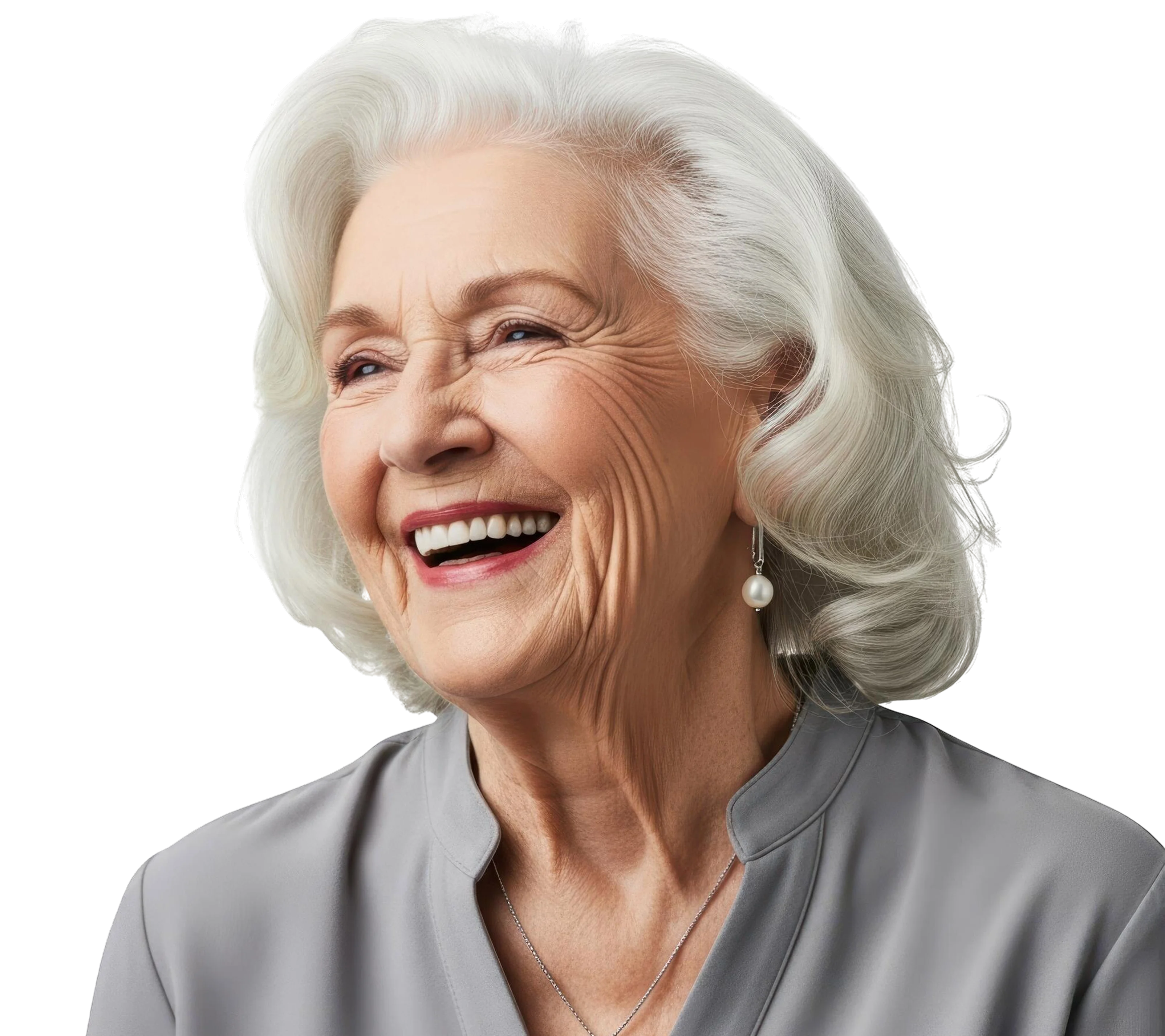 Smiling elderly woman with white hair, wearing pearl earrings and a light gray top.