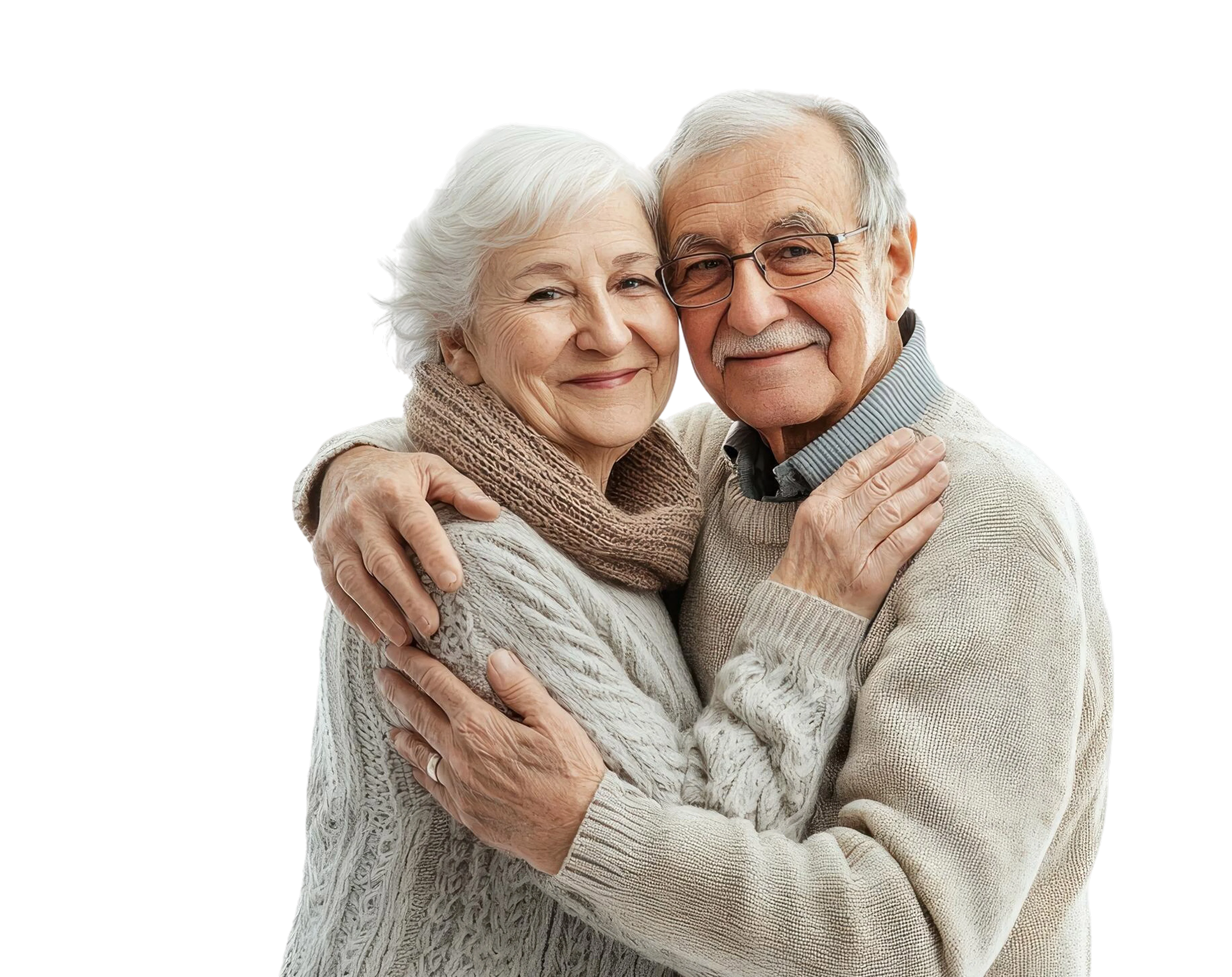 Smiling elderly couple in cozy sweaters hugging each other.