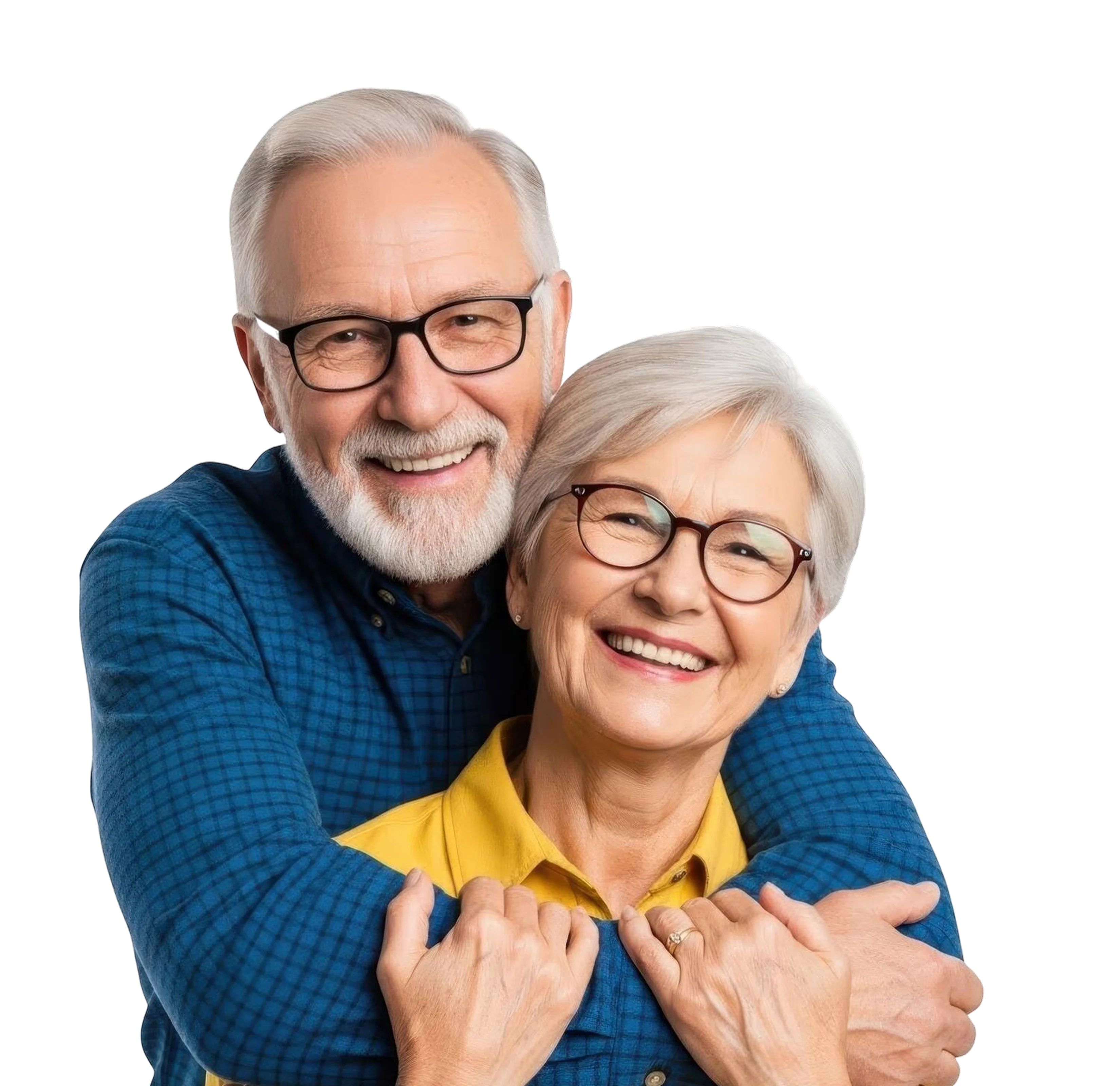 Smiling elderly couple wearing glasses, with man in blue shirt hugging woman in yellow shirt from behind.