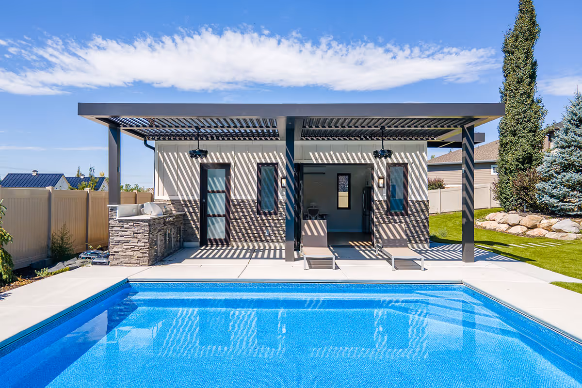 A motorized louvered roof project in a Salt Lake City yard with a swimming pool.