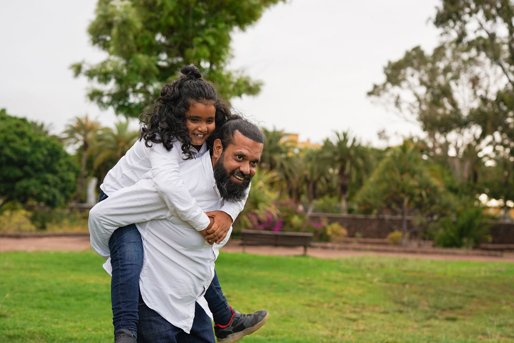 A happy father with his daughter after he's recieved coustody of her following a divorce