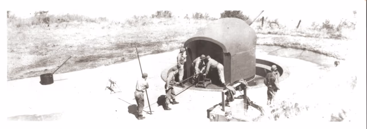 Historical photograph of gunners manning their post at Battery 245