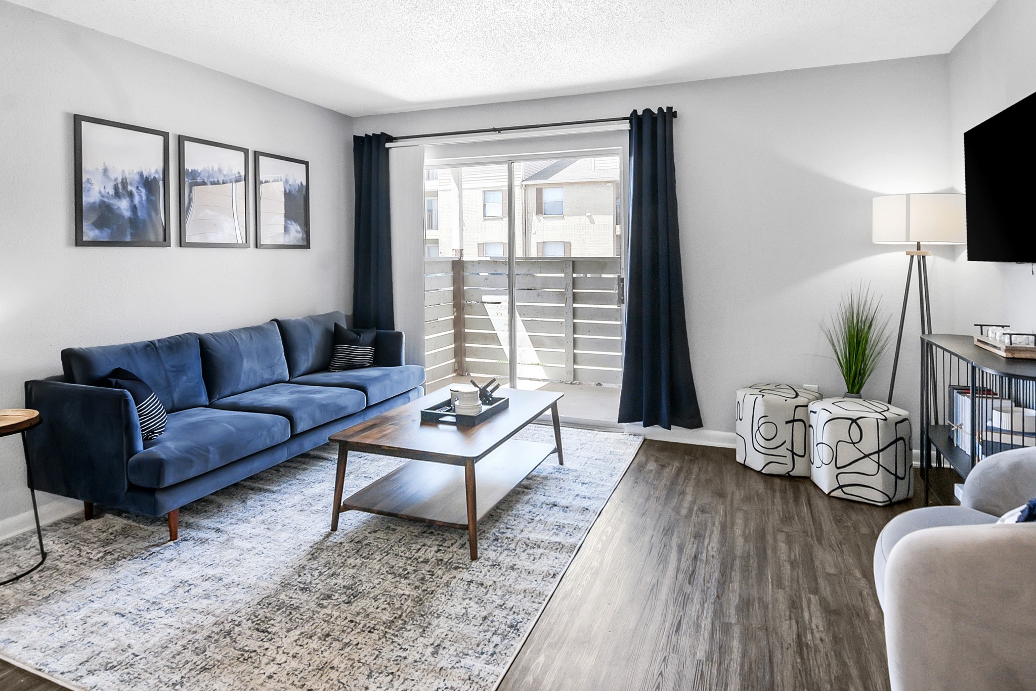 living area with view of patio balcony