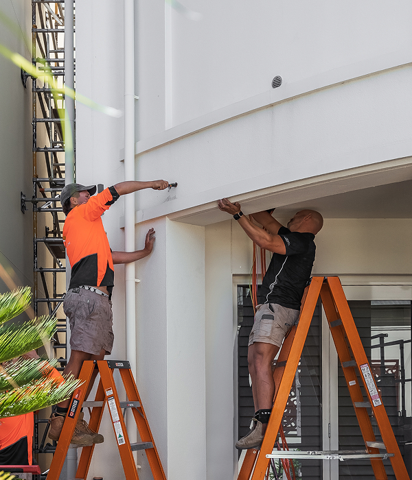 Electricians-working-on-ladders