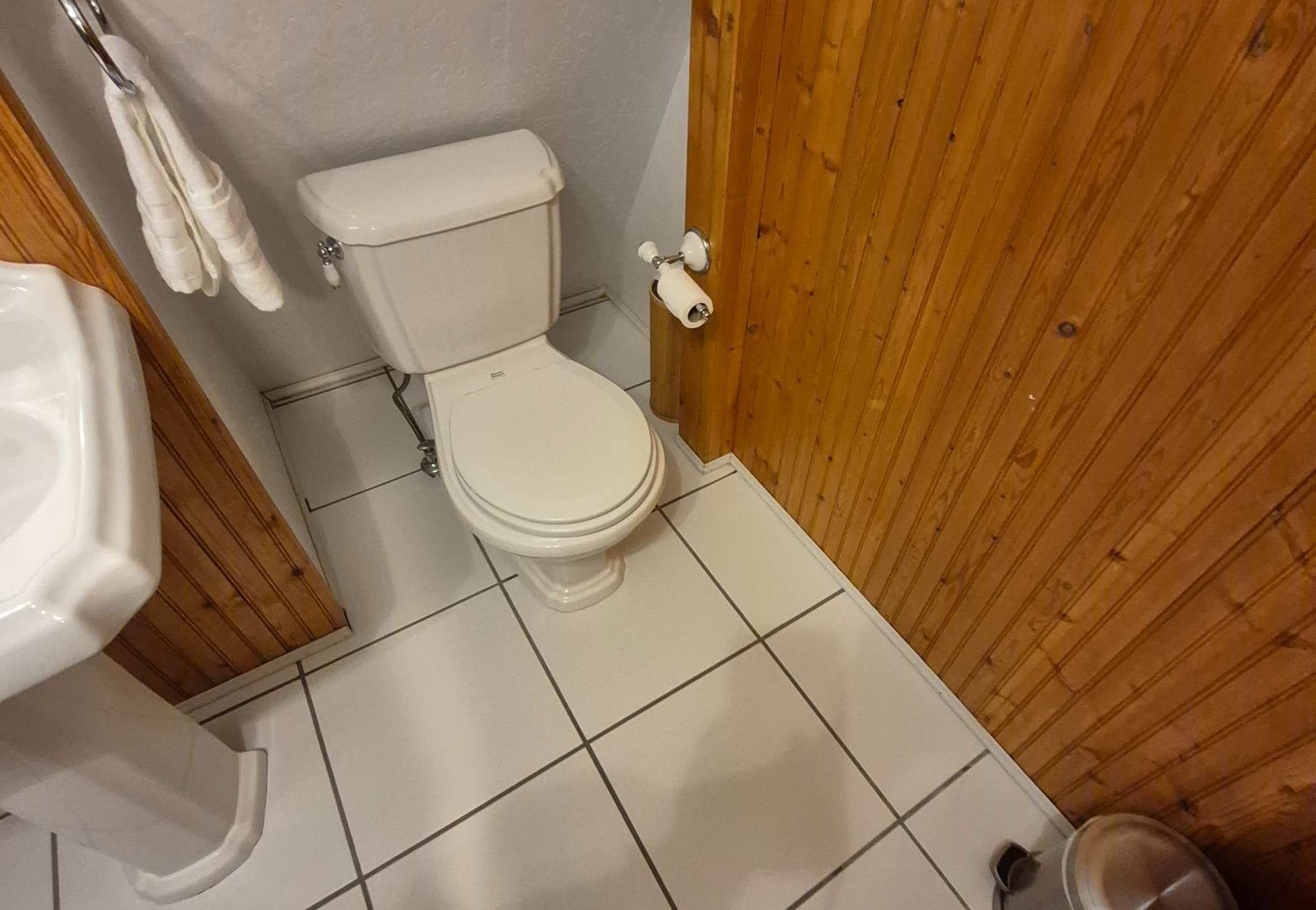 high angle of an air bnb bathroom that has just been cleaned after renters left