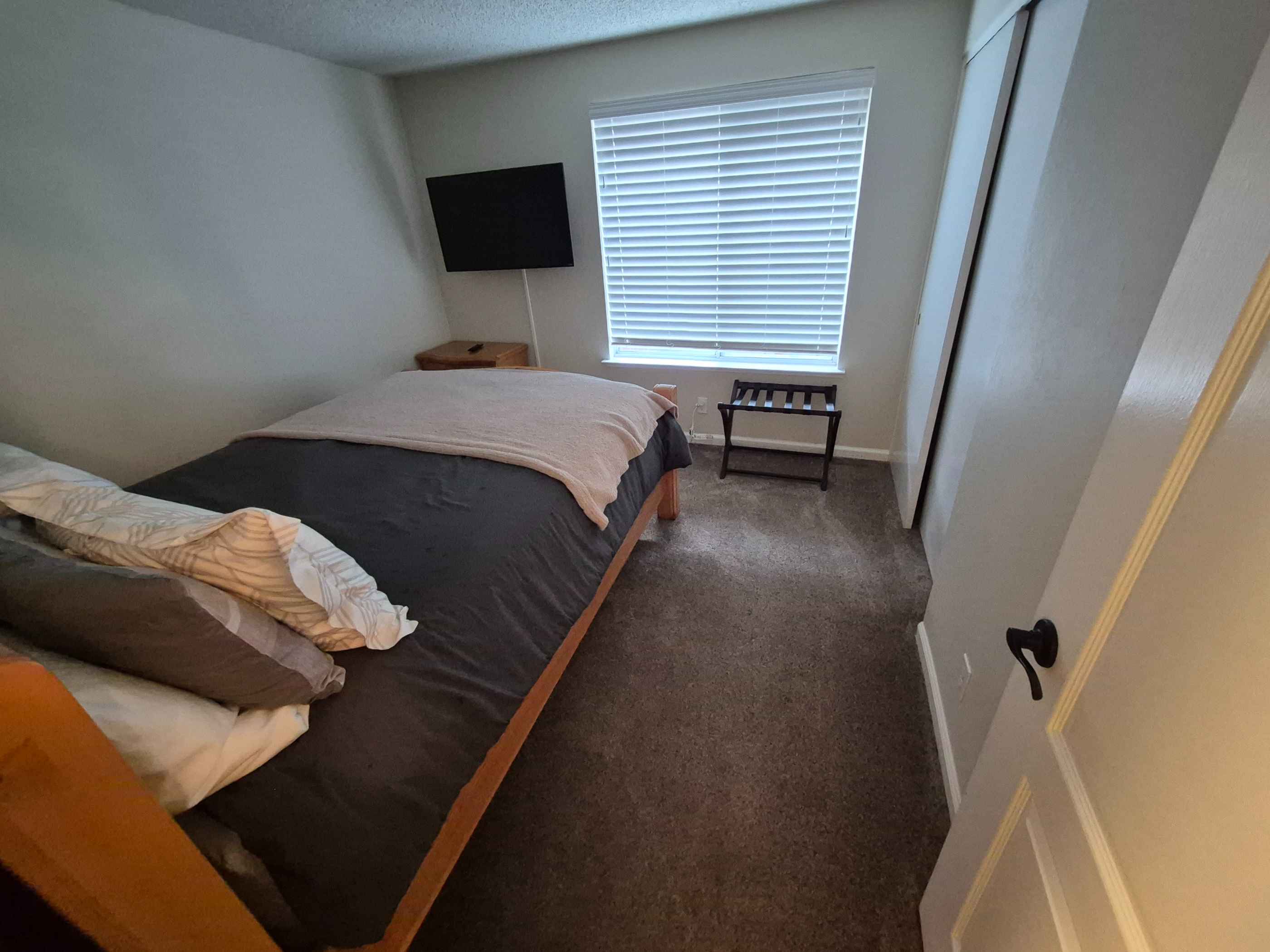 a clean home bedroom that has just been vacuumed and cleaned