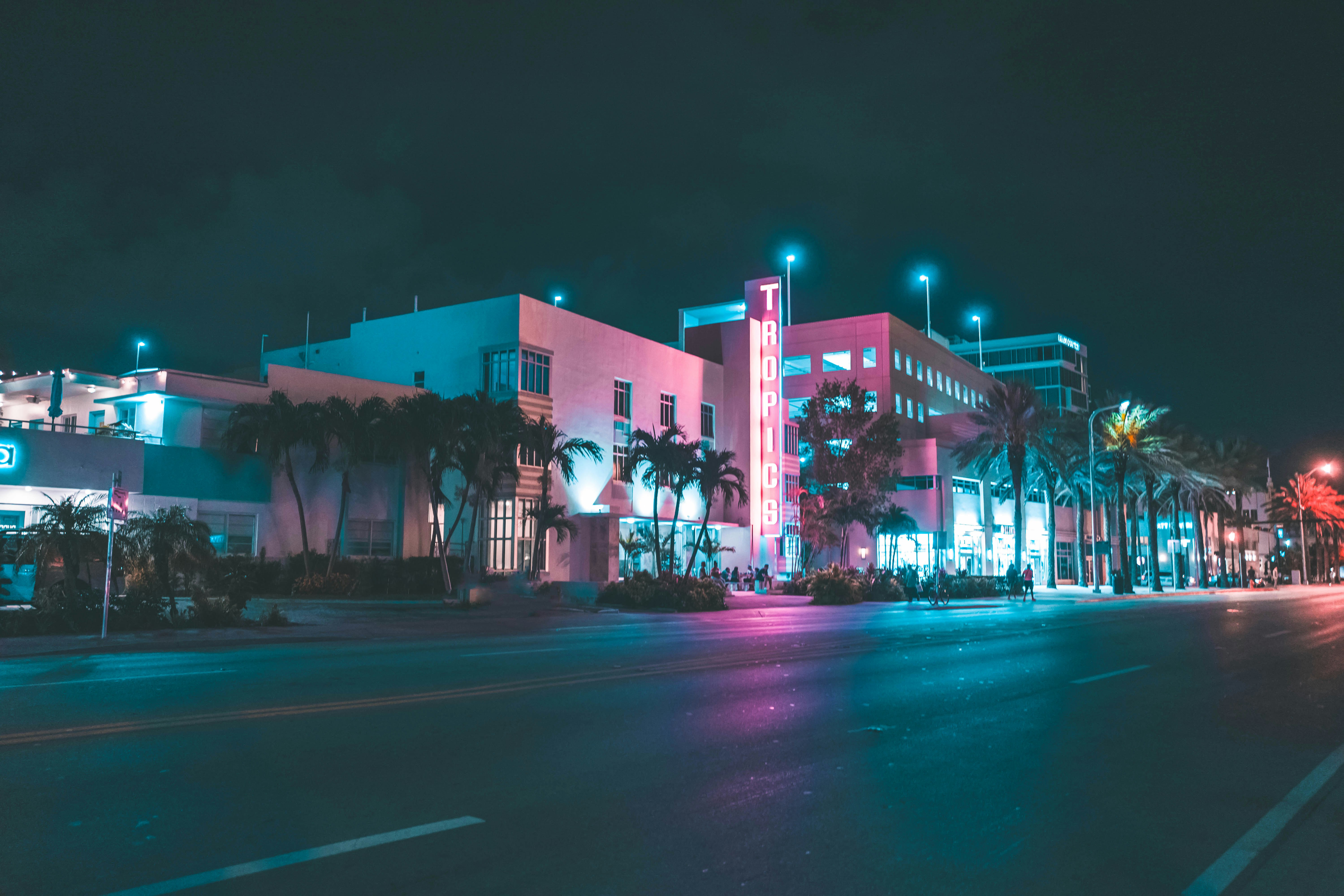 An evening view of an art deco building lit with neon in Miami Beach, Florida