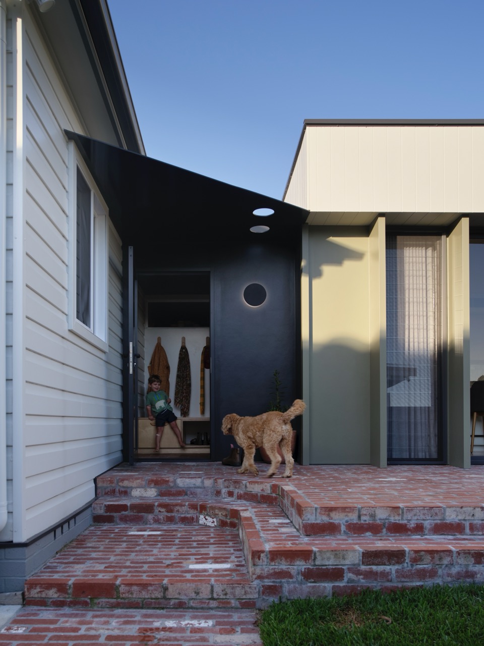 dog entering house to architectural entry threshold