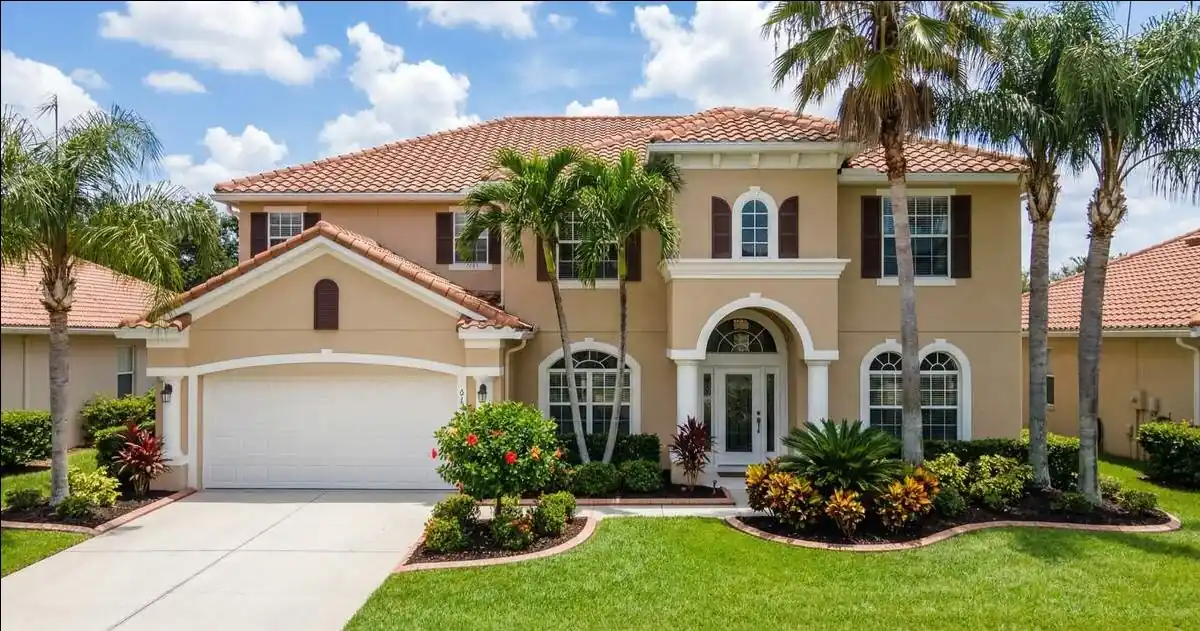 Two-story home in Orlando, FL with newly painted stucco and trim