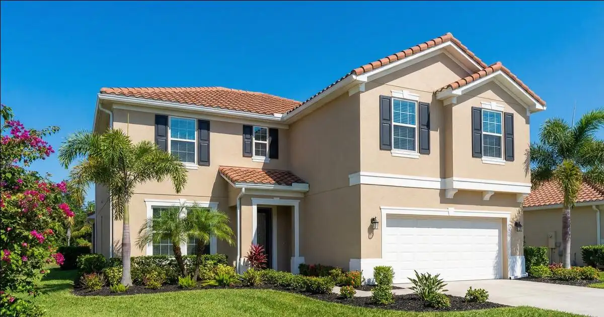 Orlando home prepared for exterior painting - surfaces cleaned and masked before repaint