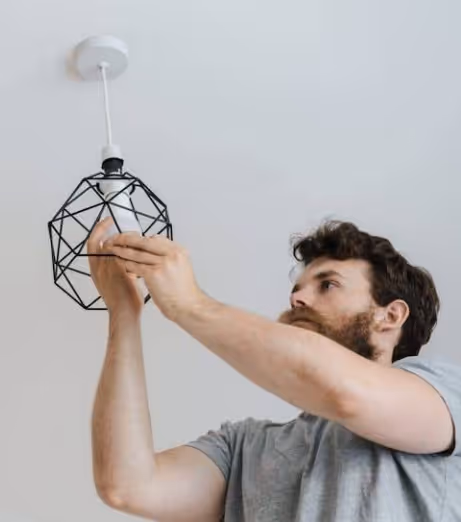 how many men to change a light bulb