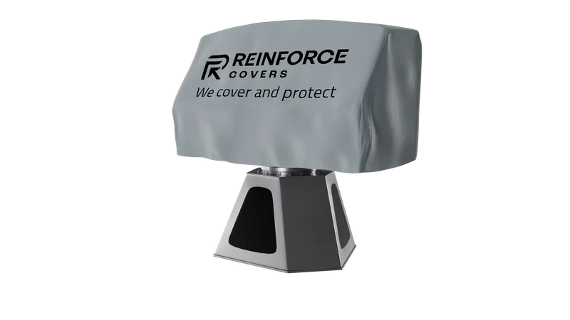 Bild von einem lampenförmigen elektrischen Gerät welches mit einer grauen Plane verdeckt ist auf welcher "Reinforce Covers" und "We cover and protect" steht.