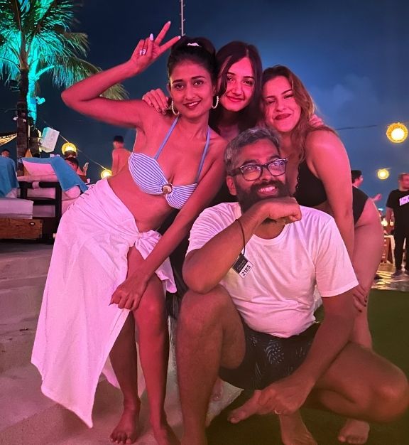 Group of four friends posing and smiling at finns bali