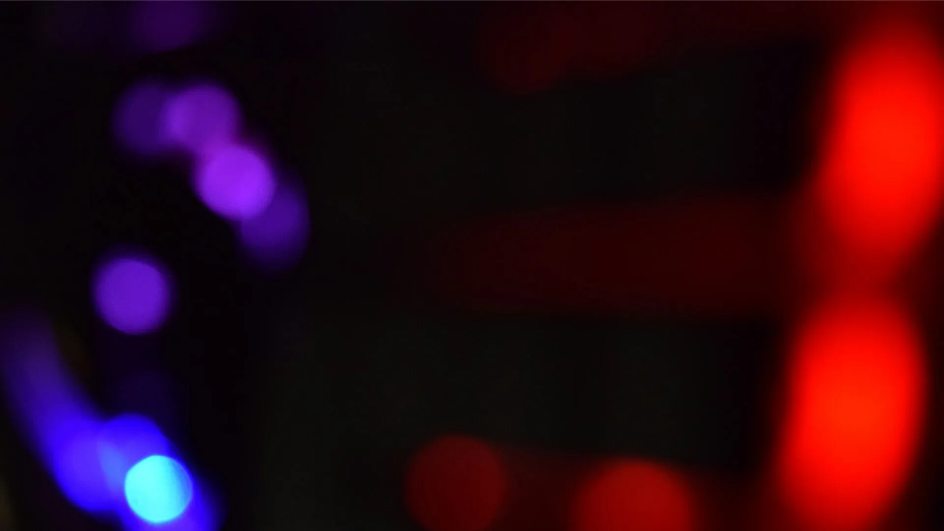 a blurry photo of a cell phone in a dark room