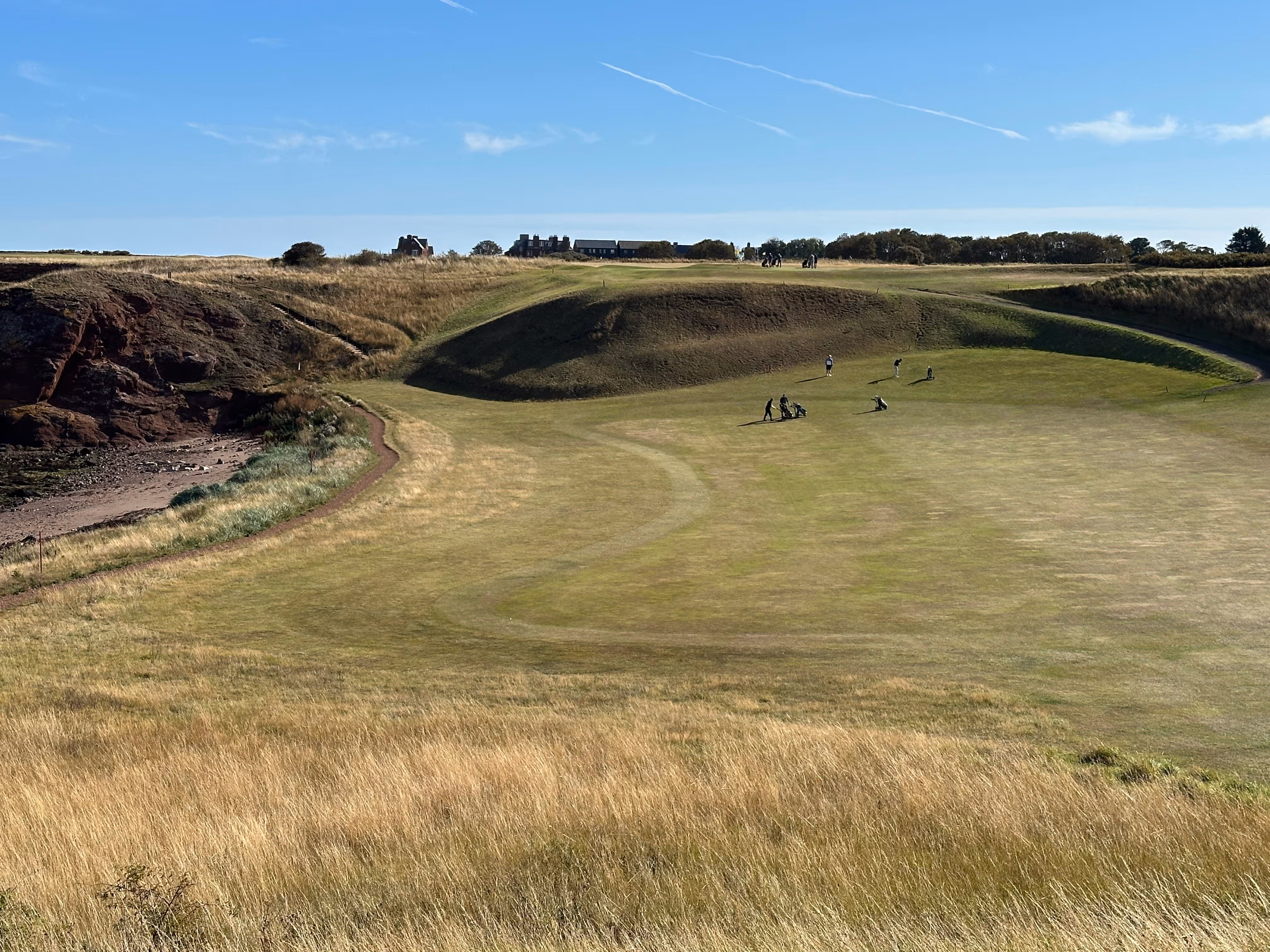 A view over the sunny greens of Winterfield Golf Club, Dunbar. 
