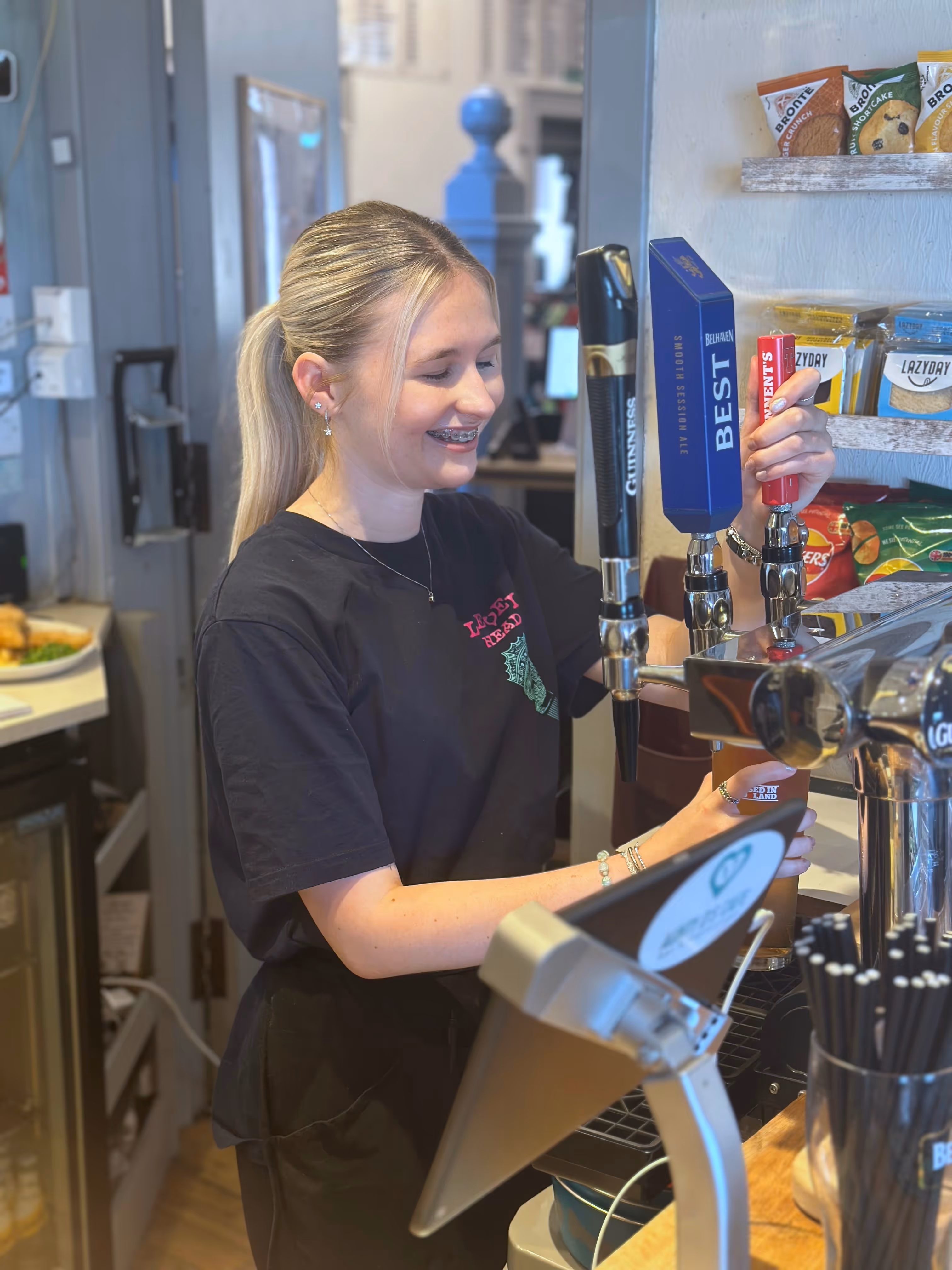 Tiegan Connelly pours a pint behind the bar at Aunty D's Cafe Bar and Restaurant, Dunbar.
