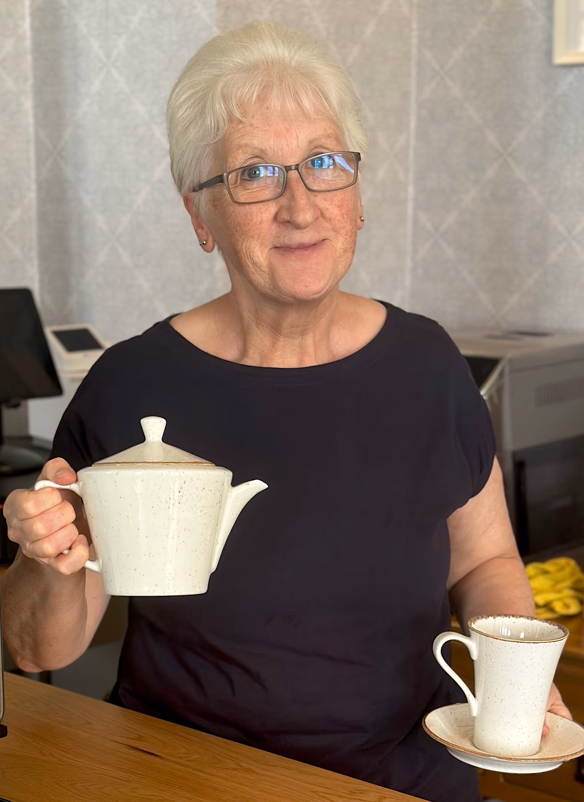 Doreen, aka Doreen, of Aunty D's Cafe Bar and Restaurant, posing with a teacup and teapot!