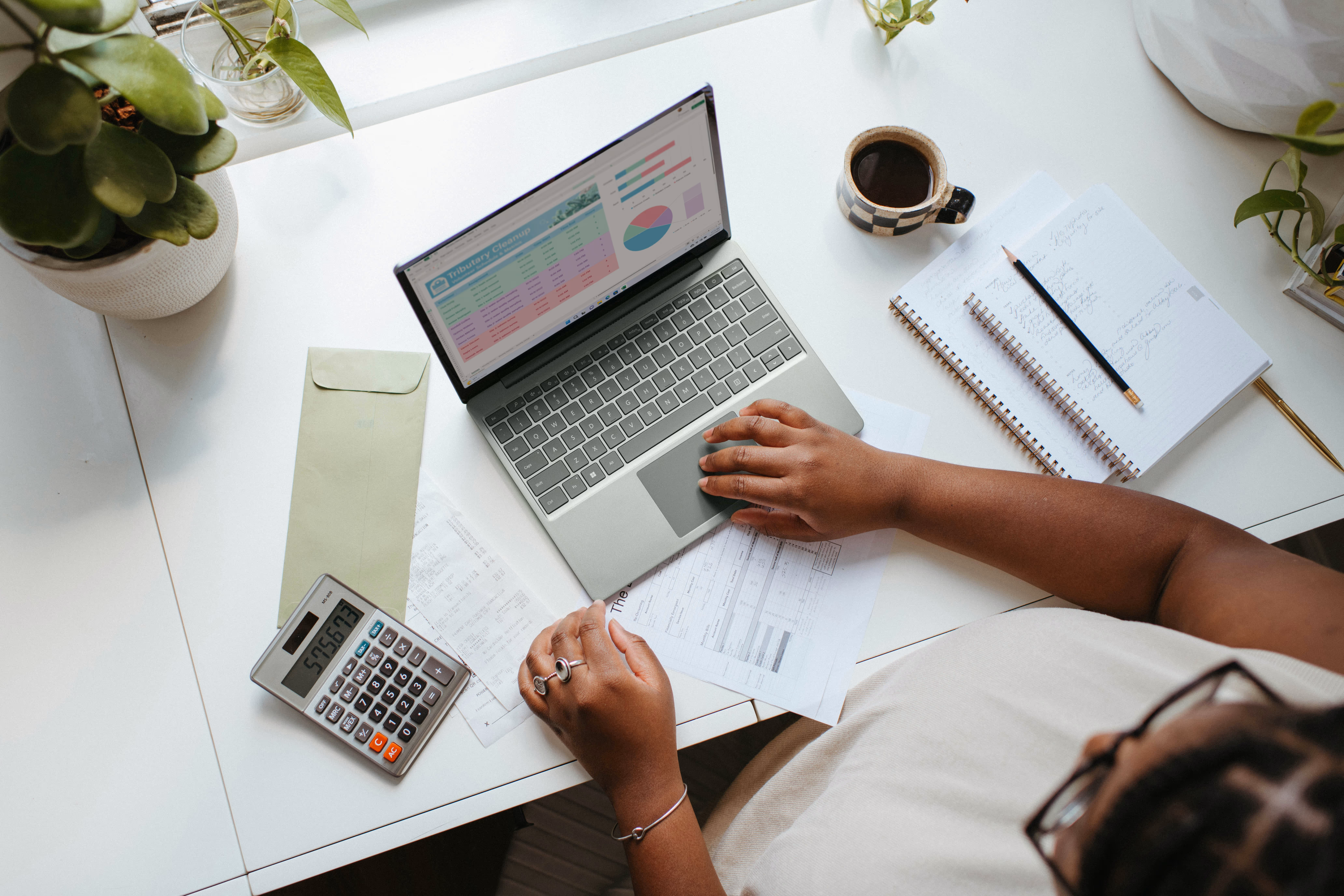 A person reviewing their bookkeeping for their business.