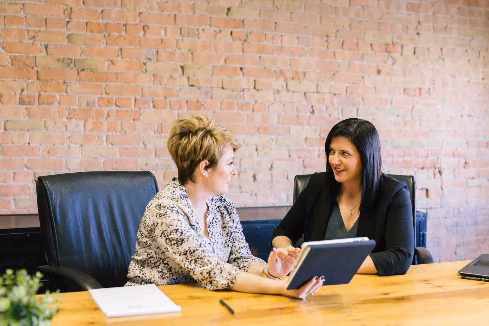 small business owner working on laptop - payroll and billing software