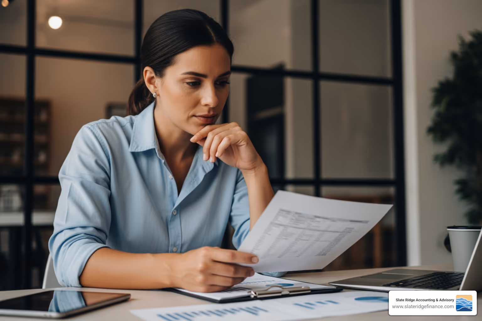 small business owner reviewing financial reports - best accounting services for small business