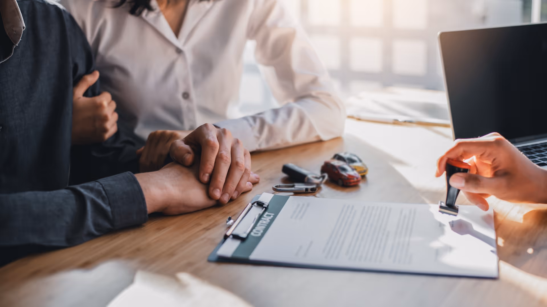 Mortgage agent walking couple through a document
