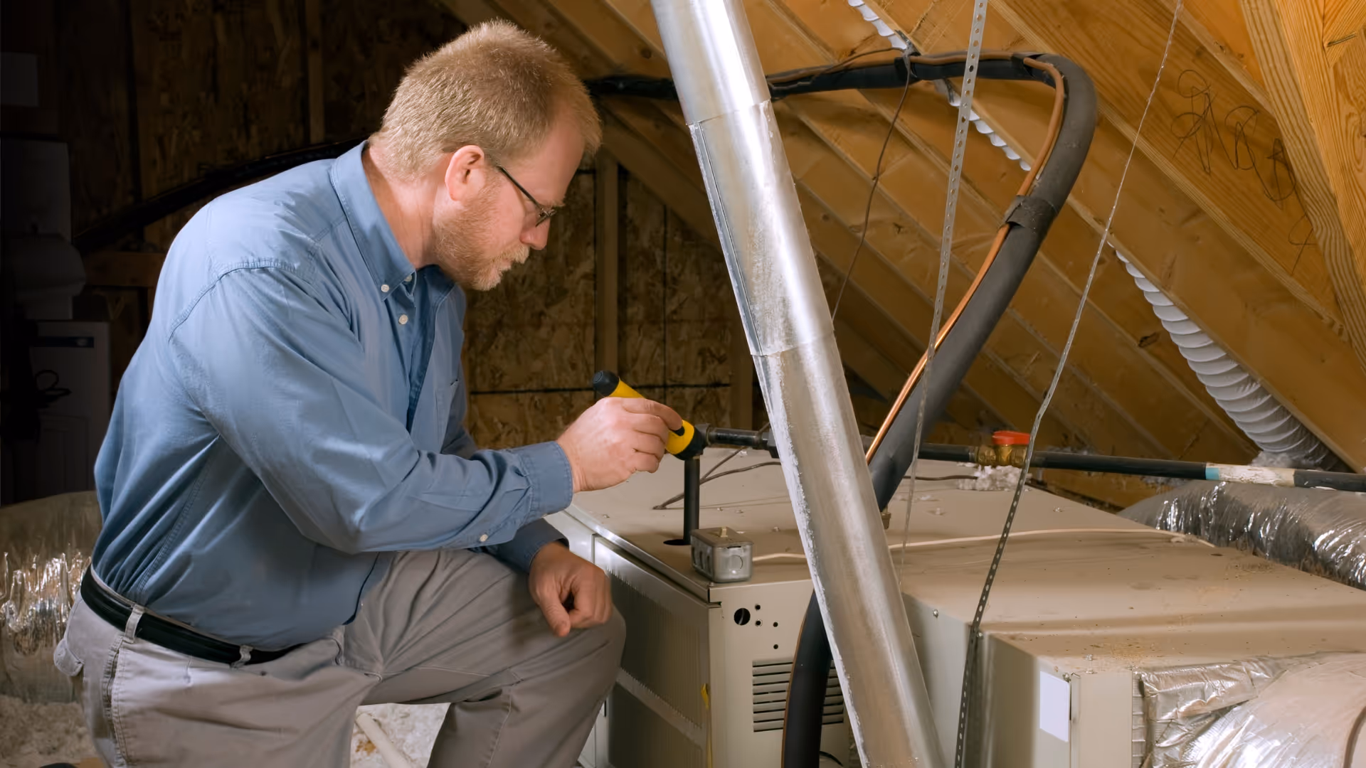 Home inspector analyzing the furnace in a home