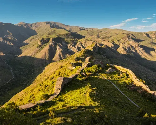 Ancient Smbataberd Fortress ruins in Armenia, overlooking the rugged mountains and valleys.