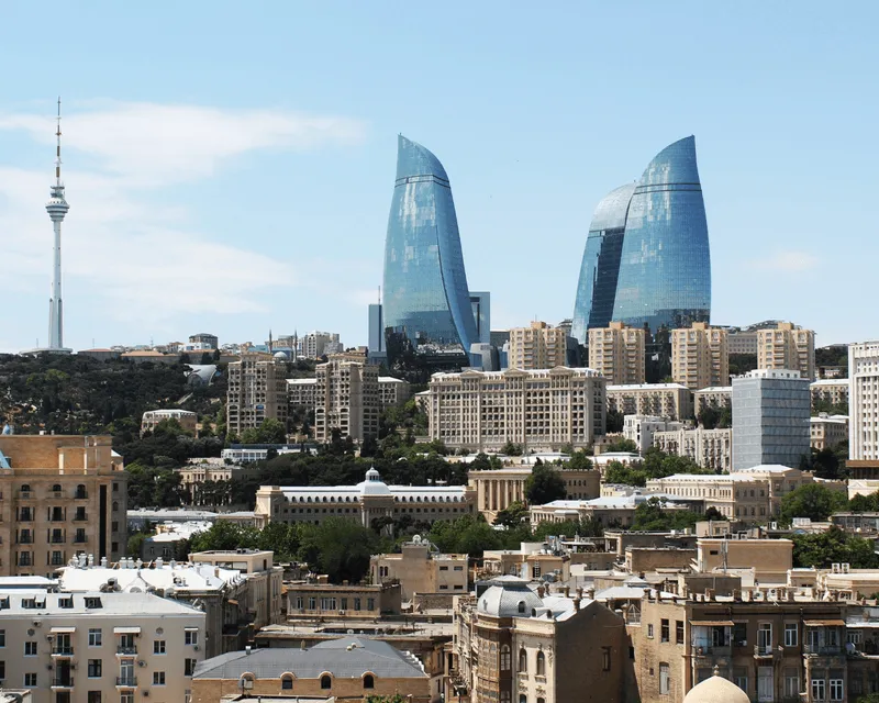 Baku, Azerbaijan skyline featuring the iconic Flame Towers and the city’s mix of historic and modern architecture.