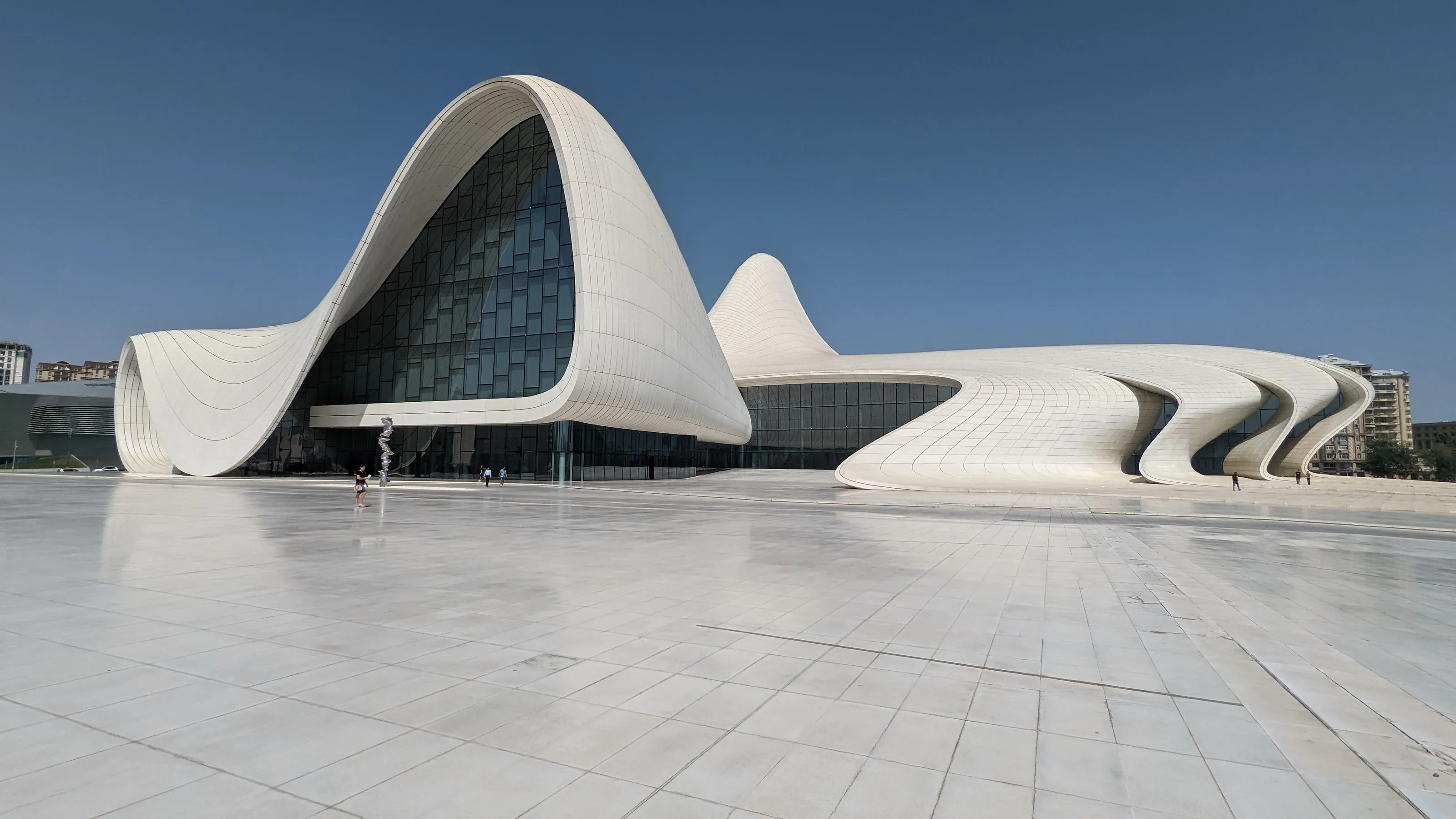 The Heydar Aliyev Center in Baku, Azerbaijan, with its futuristic, flowing white architecture designed by Zaha Hadid.