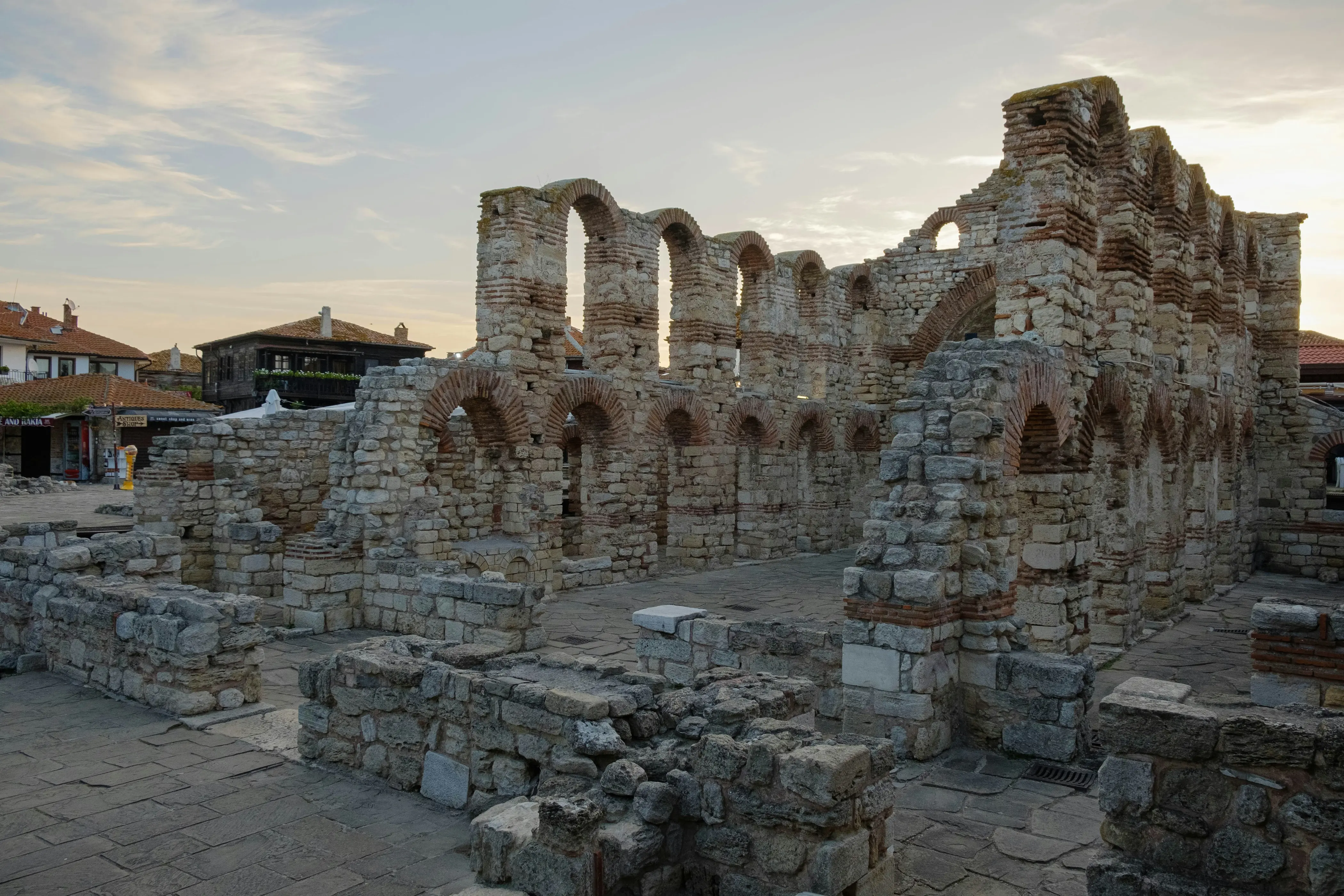 Nessebar Church Ruins – Ancient stone and brick church ruins in Nessebar, Bulgaria, with arched windows and weathered walls.