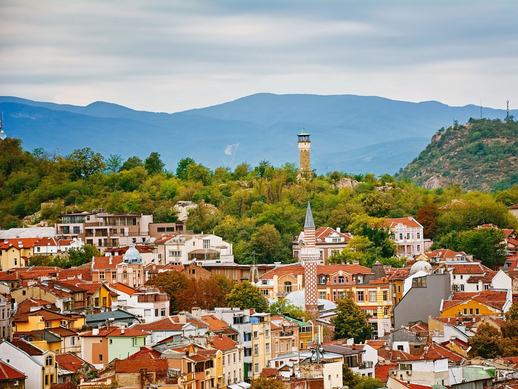 Panoramic view of Plovdiv, Bulgaria with a hilltop watchtower and red-roofed houses