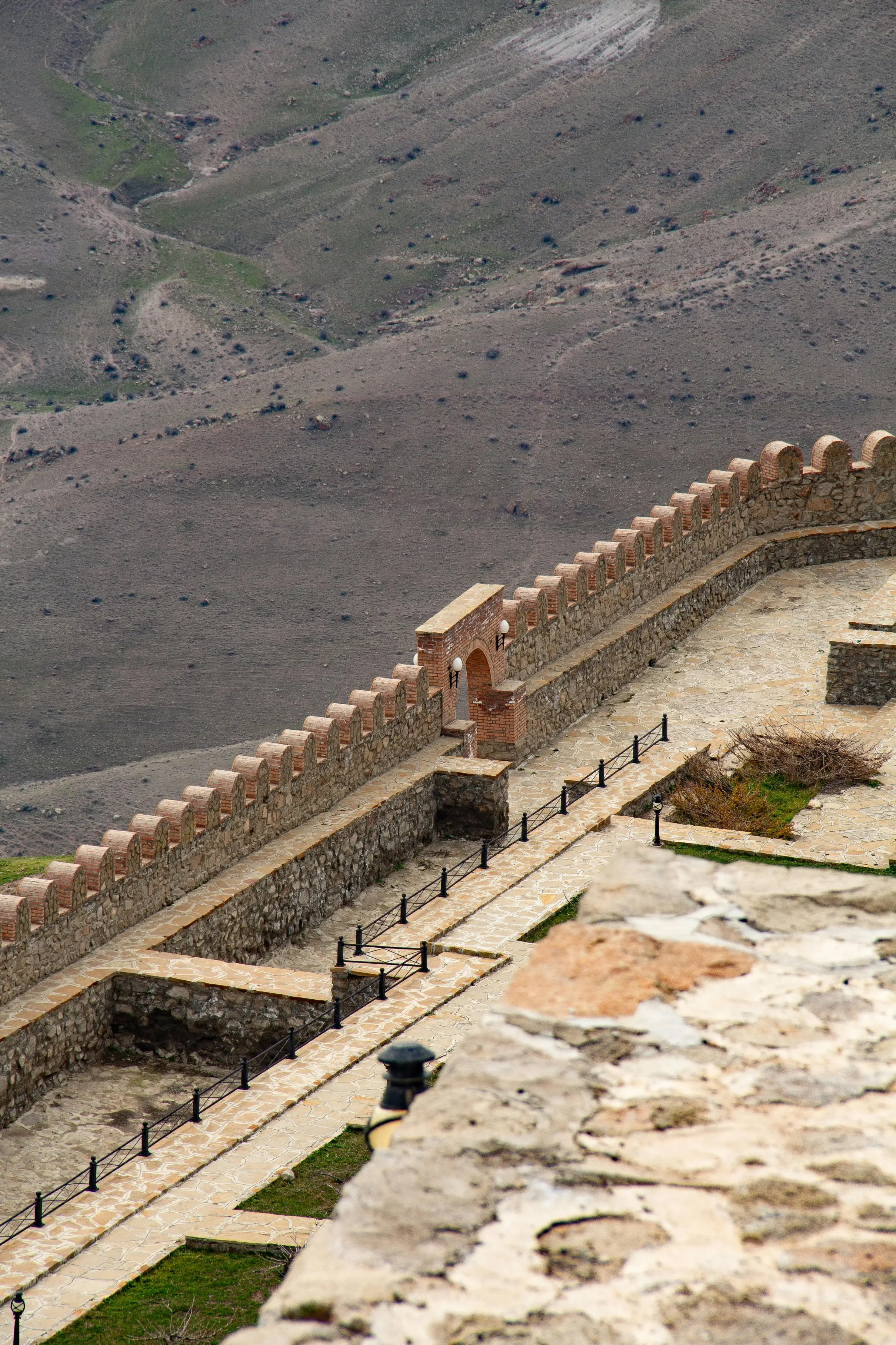 Alinja Castle Walls, Nakhchivan - Historic fortress walls overlooking a rugged mountain valley in Azerbaijan.