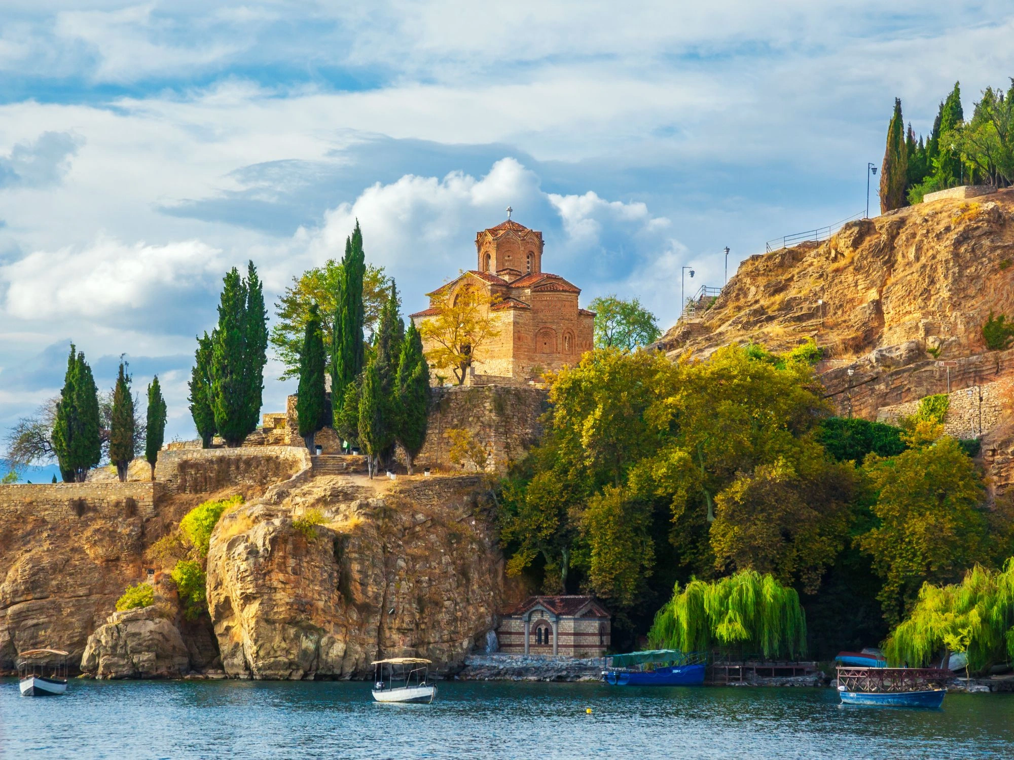 Stunning Church of St. John at Kaneo perched on cliffs above serene Ohrid Lake, North Macedonia.