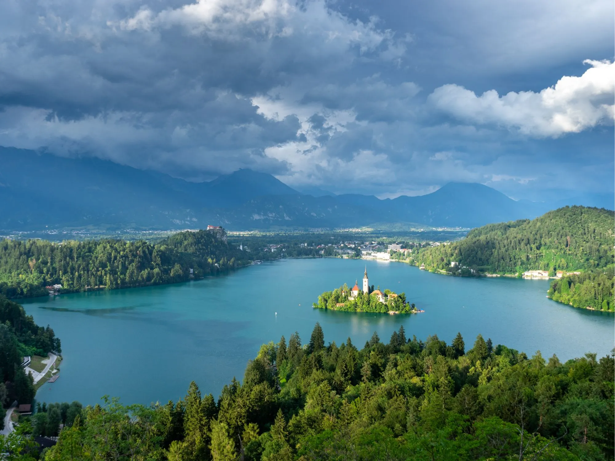 Panoramic view of Lake Bled, Slovenia, with Bled Island and the iconic Church of the Assumption – top travel destination in the Julian Alps.